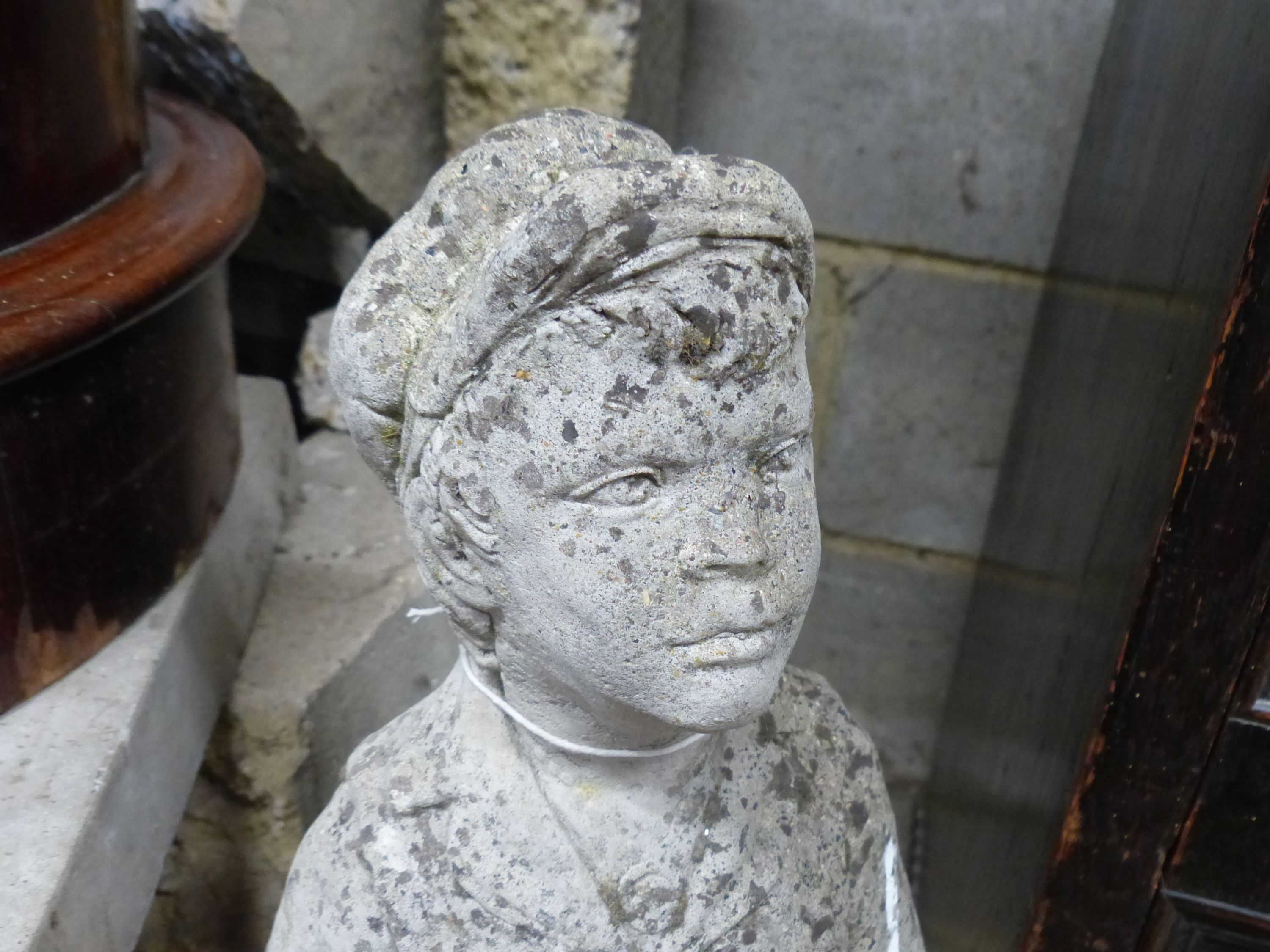 A reconstituted stone garden ornament of a boy with dog, height 69cm
